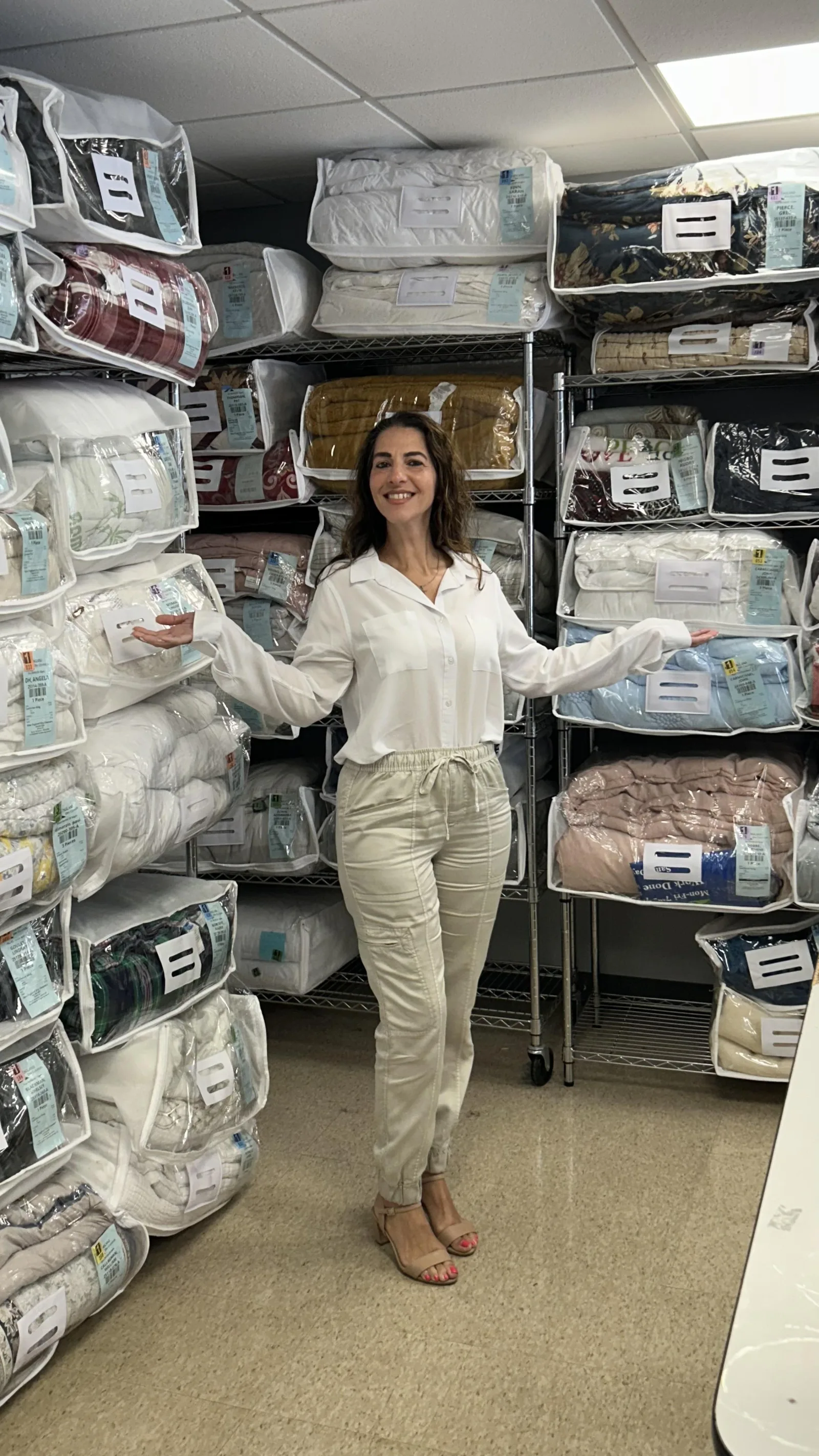 Preserved comforters and bedding stored in clean storage bags at New England Dry Cleaners